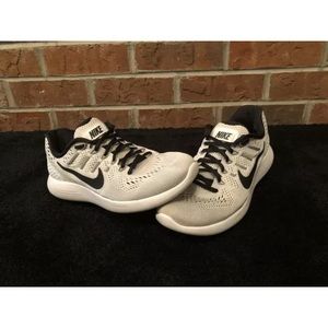 White Nike running shoes